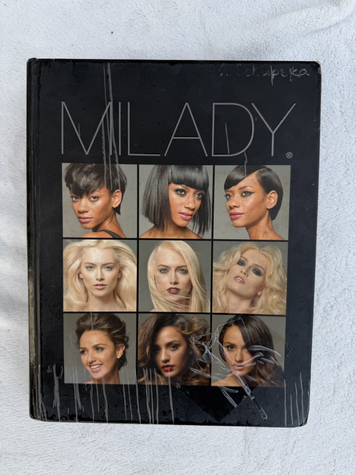 Milady Standard Cosmetology (Milady’s Standard Cosmetology) – Hardcover – GOOD